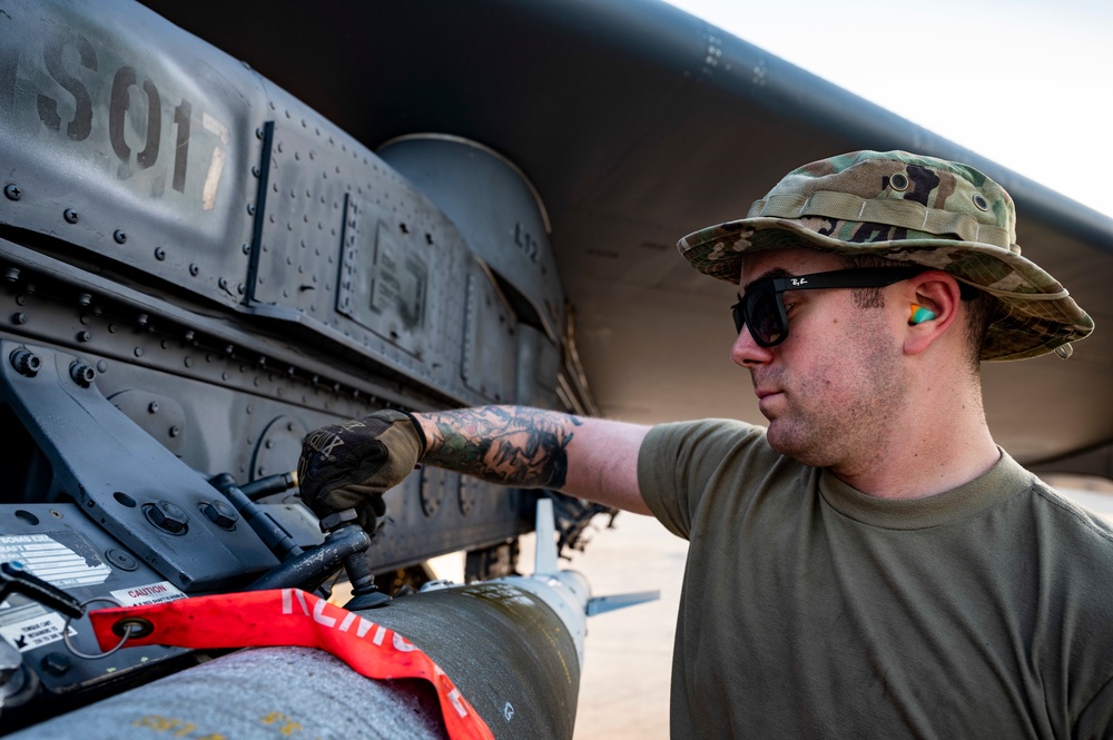 Air Force Weapons Load Crew Members Load Munitions