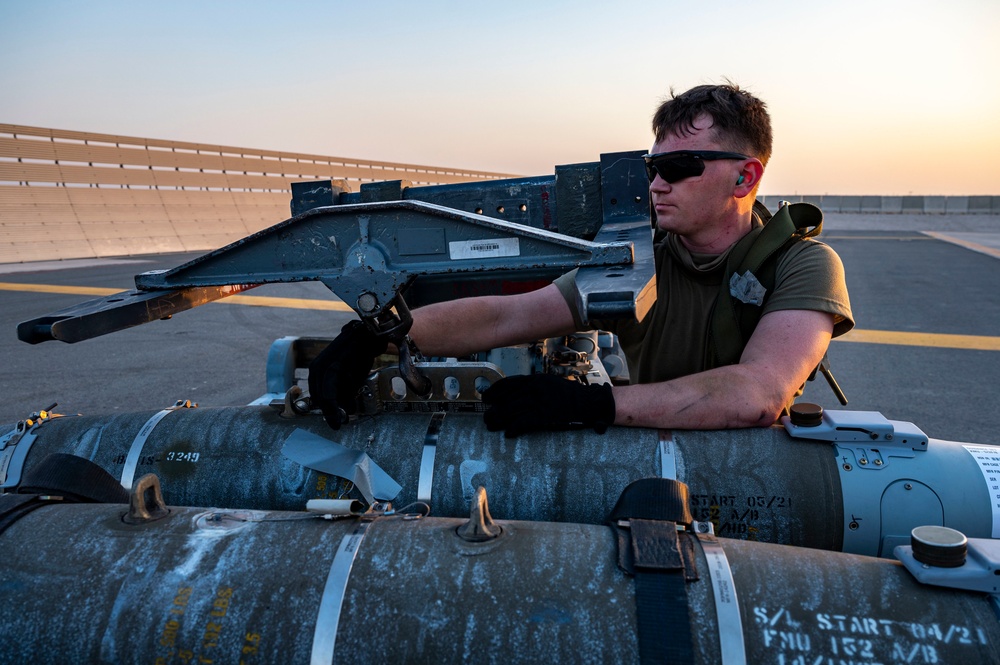 Air Force Weapons Load Crew Members Load Munitions