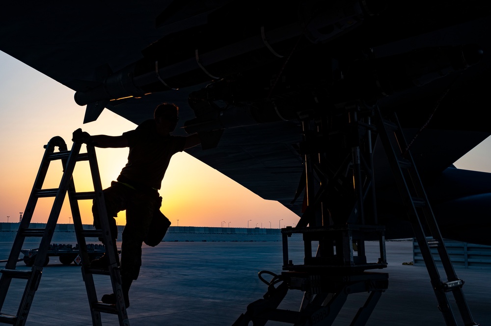 Air Force Weapons Load Crew Members Load Munitions