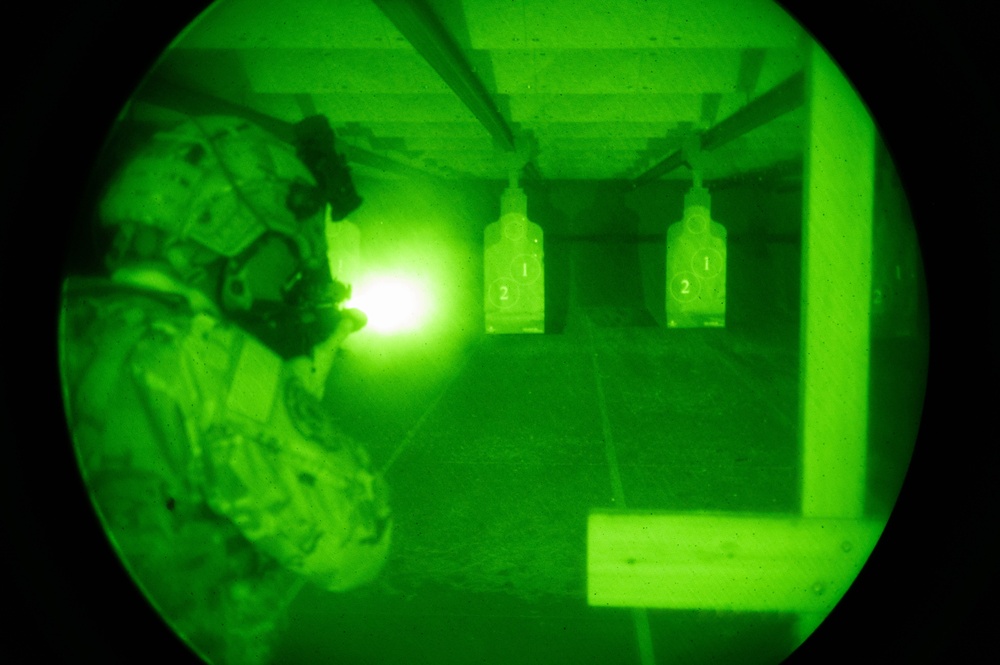 A 934th Security Forces Squadron Airman fires his M-4 during a simulated night fire training