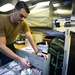 USS Sioux City Sailor Checks Medical Supplies While Holding EMRT Training