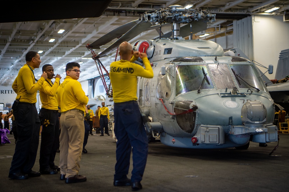 USS Carl Vinson (CVN70) Sailors Work in Hangar Bay