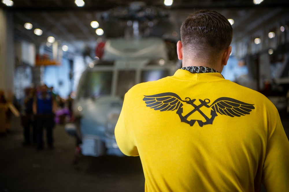 USS Carl Vinson (CVN70) Sailors Work in Hangar Bay