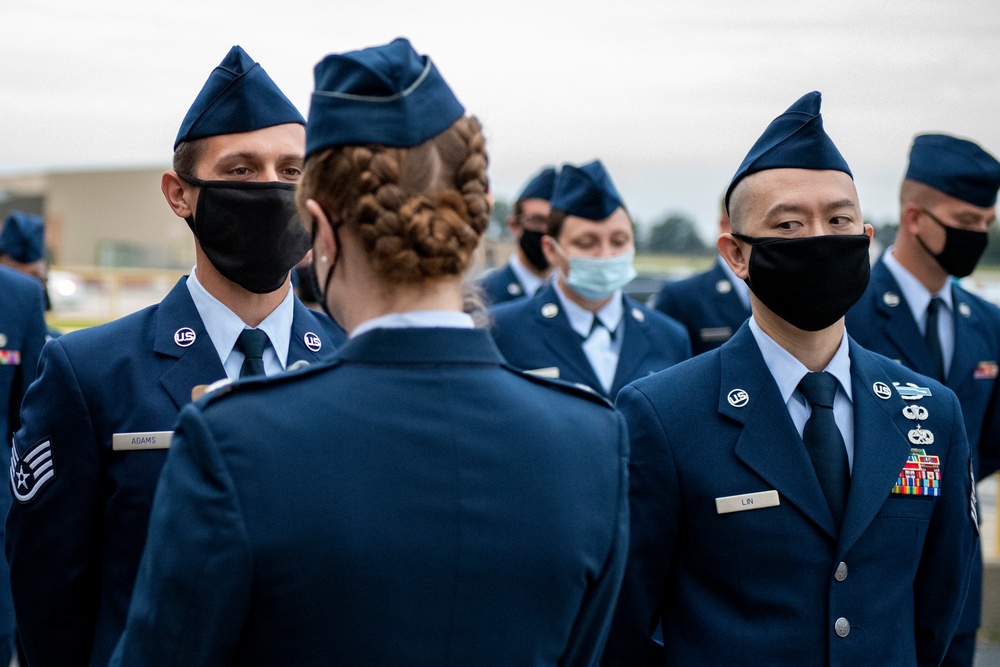 Airmen conduct open ranks inspection