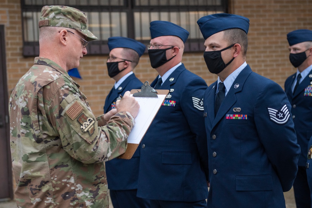 Airmen conduct open ranks inspection