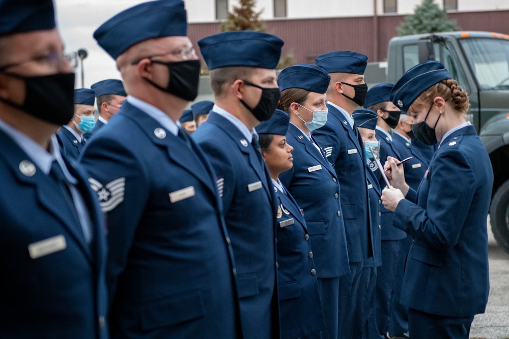 Airmen conduct open ranks inspection