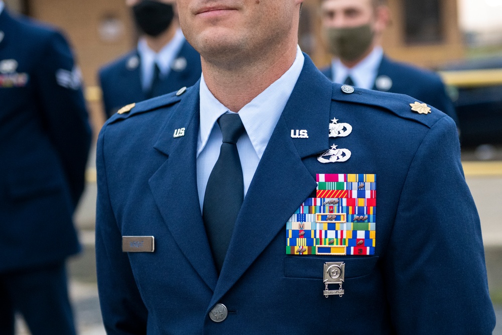 Airmen conduct open ranks inspection