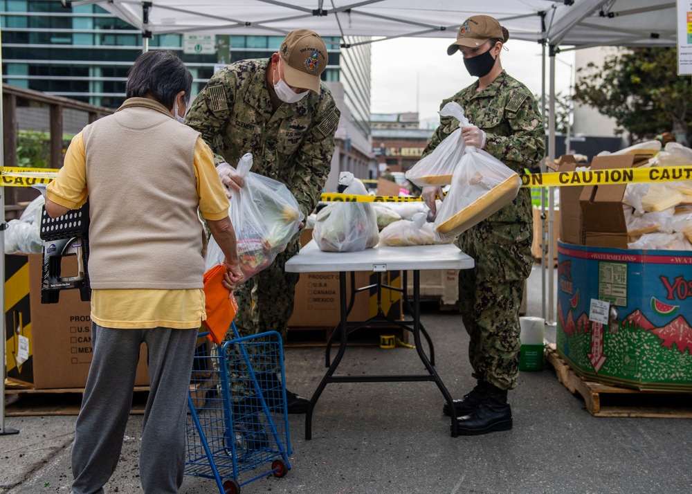 McCain Sailors package food during a community service project at SF-Marin Food Bank