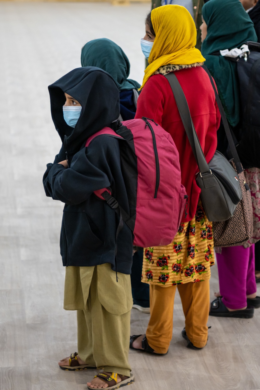 Afghan families depart from Aman Omid Village at TF Holloman