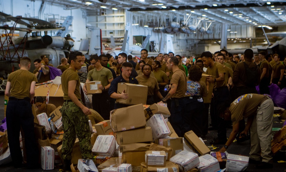 USS Carl Vinson (CVN70) Sailors Work in Hangar Bay