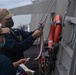 USS Jackson (LCS 6) Sailors Hoist Ensign