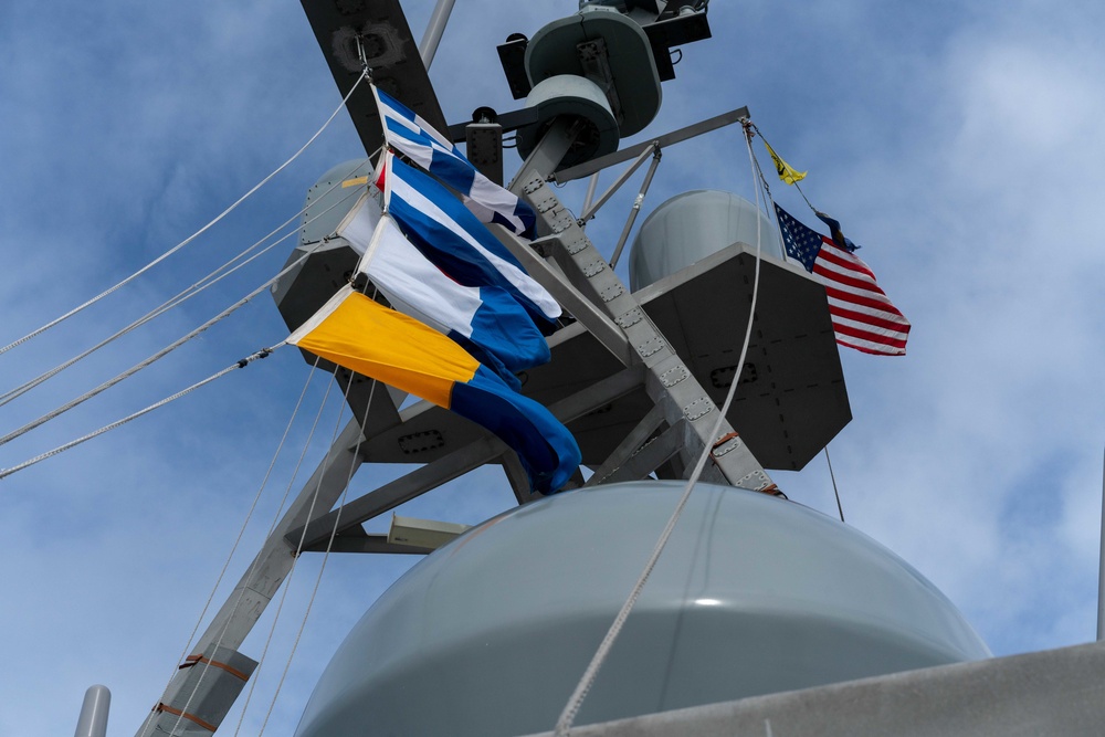 USS Jackson (LCS 6) Sailor Hoists Call Sign Flags