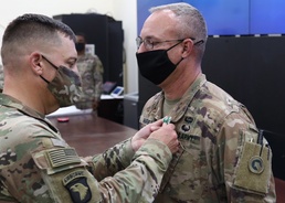 Chief Warrant Officer 4 Scott O. Harned receives combat award