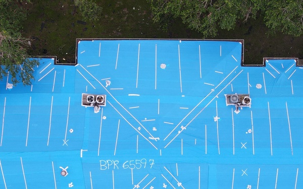 Multi-family housing units with U.S. Army Corps of Engineers blue roofs following Hurricane Ida