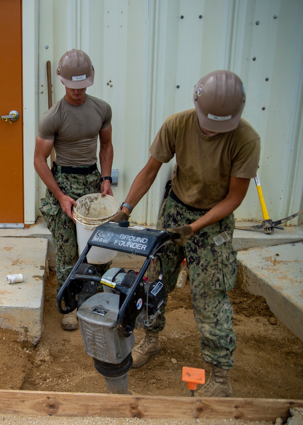U.S. Navy Seabees assigned to NMCB-5 prepare for concrete placement