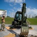 U.S. Navy Seabees assigned to NMCB-5 prepare for concrete placement