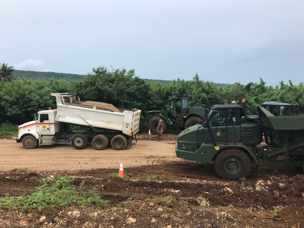 U.S. Navy Seabees with NMCB-5 work on Marpo Heights Road project