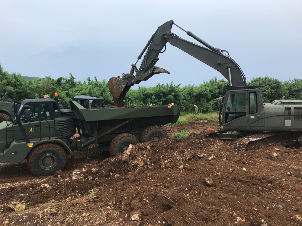 U.S. Navy Seabees with NMCB-5 and U.S. Marines with 7th ESB support projects in Tinian, Northern Mariana Islands