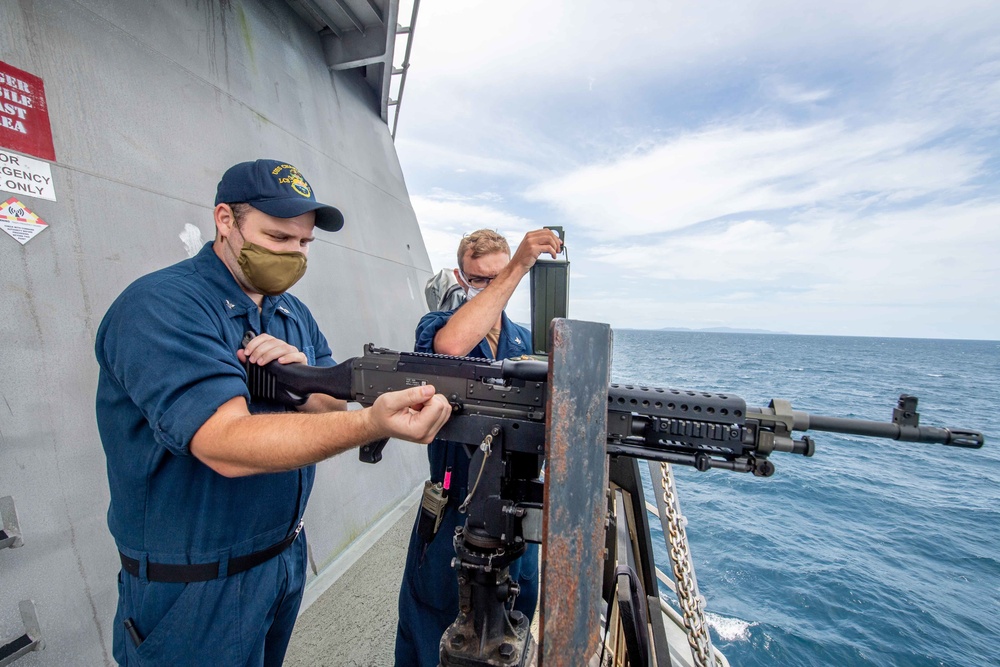 USS Charleston Sailors Mount a M240B Machine Gun