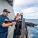 USS Charleston Sailors Mount a M240B Machine Gun
