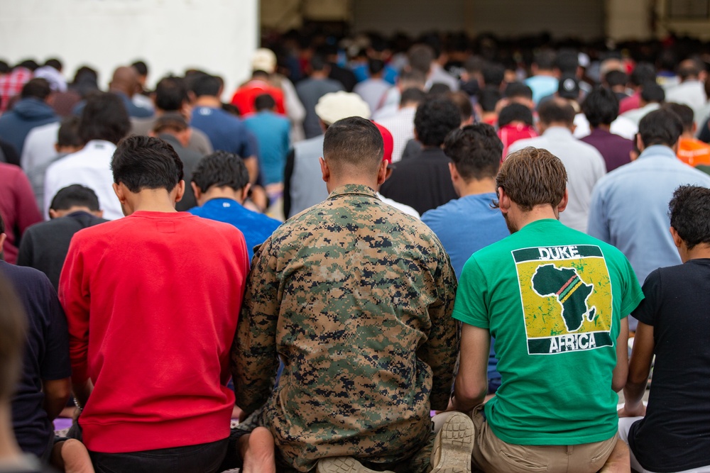 U.S. Marine sits in prayer during Religious Services on TF Quantico