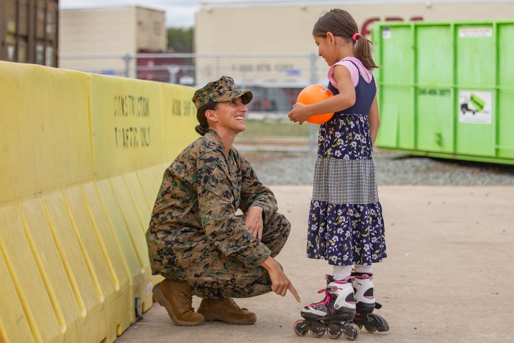U.S. Marine interacts with an Afghan Child on TF Quantico
