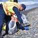 Tar balls being removed from shores in Oceanside Harbor Beach in San Diego County