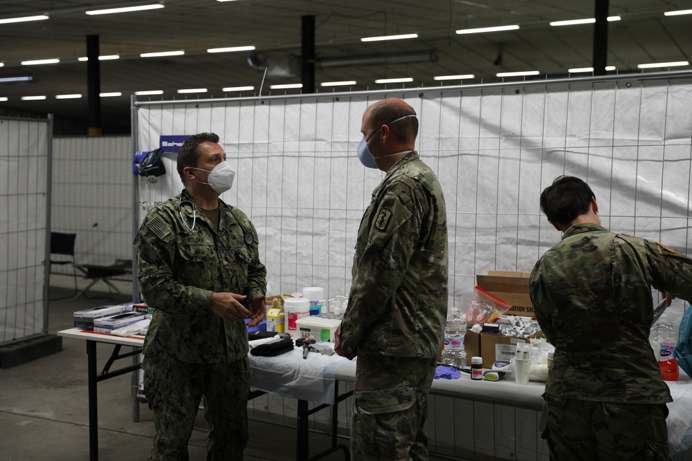 Medical staff from service forces work side by side in support of Operation Allies Welcome