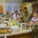 50th Regional Support Group Soldiers prepare meal with locals in Poland
