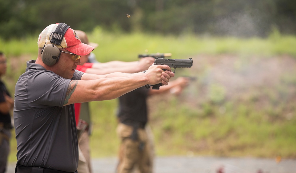 Marine Corps Reserve Action Shooting Team trains with the Marine Corps Action Shooting Team.