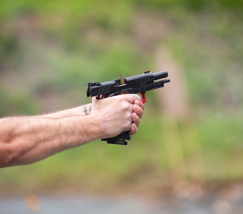 Marine Corps Reserve Action Shooting Team trains with the Marine Corps Action Shooting Team.