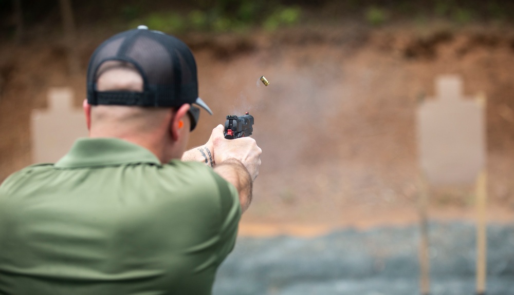 Marine Corps Reserve Action Shooting Team trains with the Marine Corps Action Shooting Team.