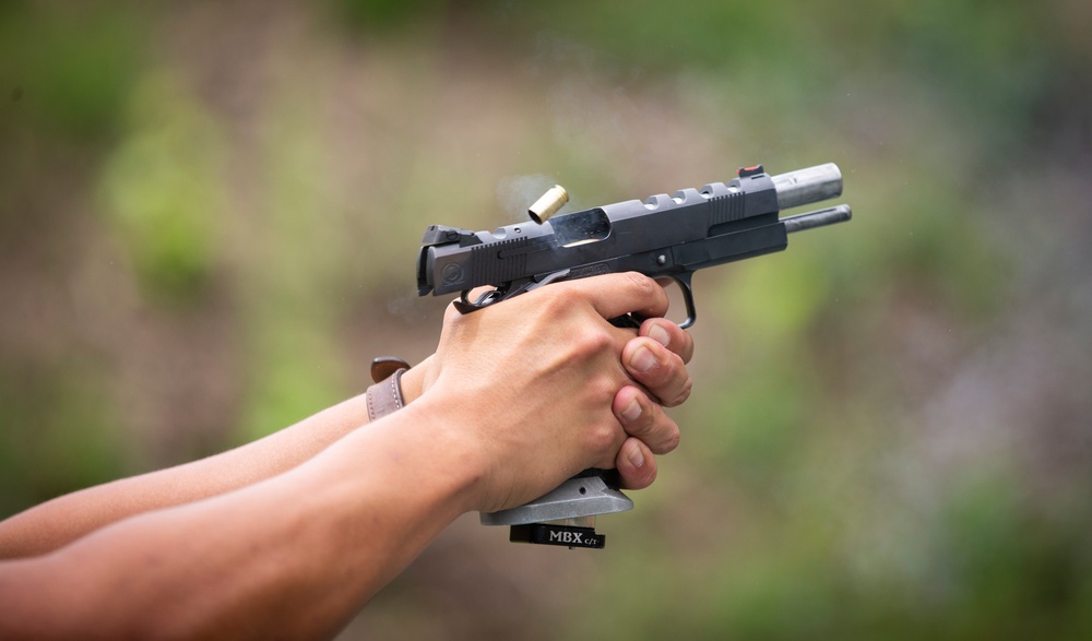 Marine Corps Reserve Action Shooting Team trains with the Marine Corps Action Shooting Team.