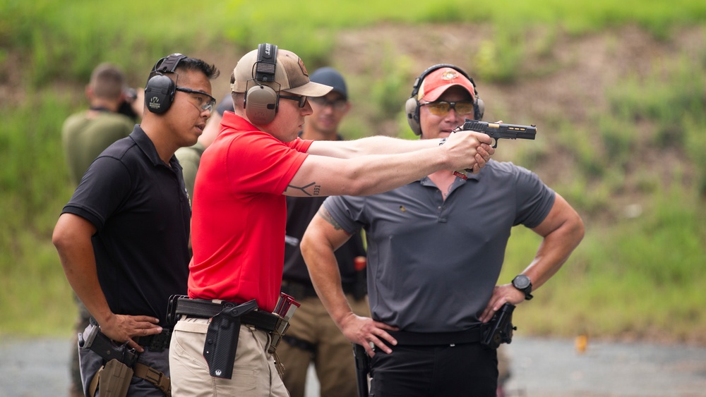 Marine Corps Reserve Action Shooting Team trains with the Marine Corps Action Shooting Team.