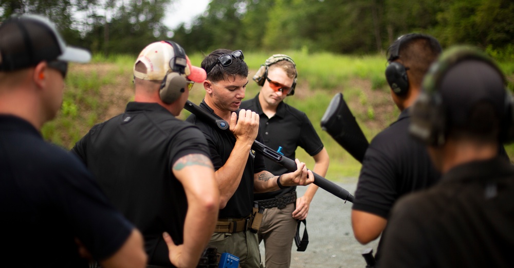 Marine Corps Reserve Action Shooting Team trains with the Marine Corps Action Shooting Team.