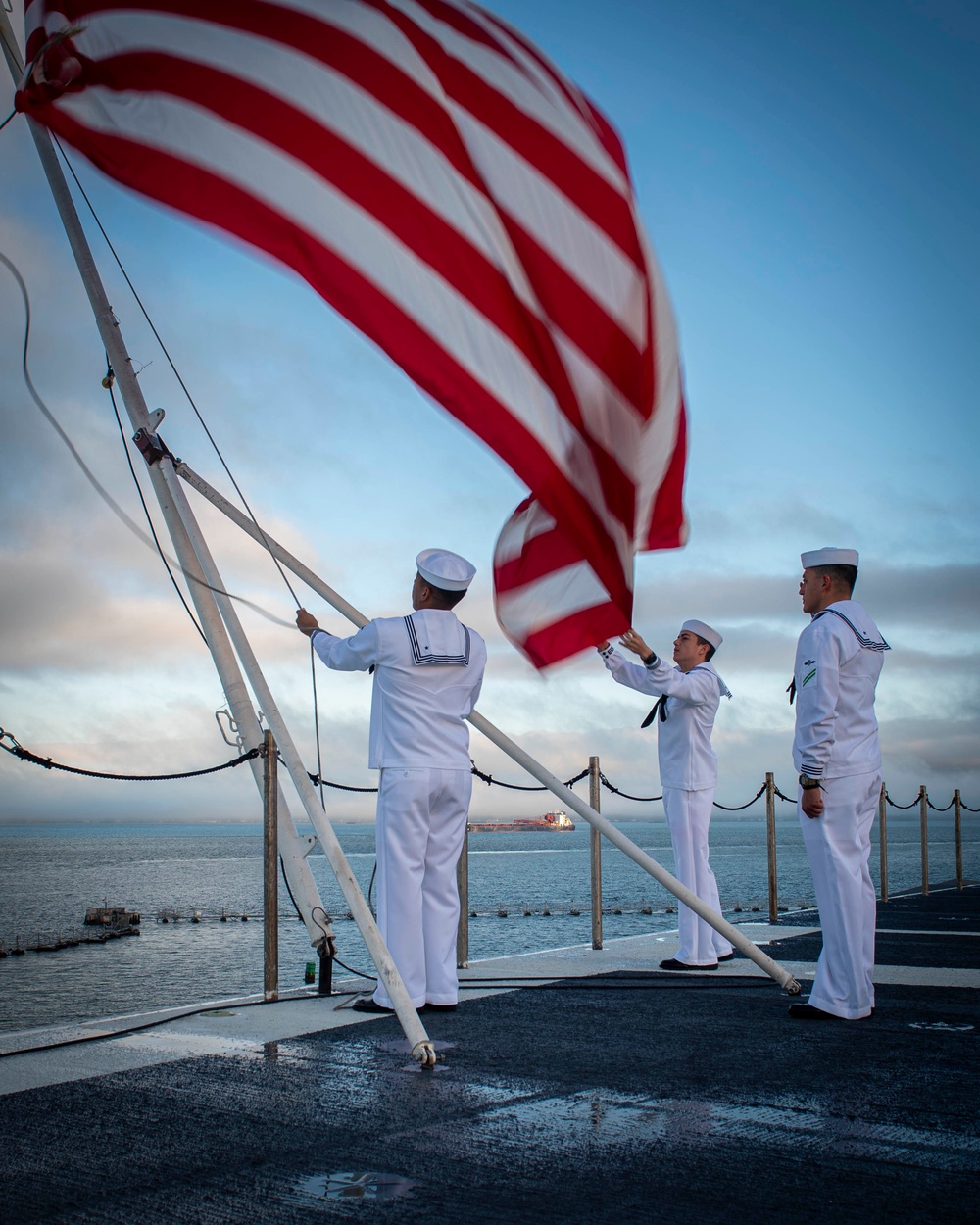 GHWB Sailors Hoist Holiday Ensign