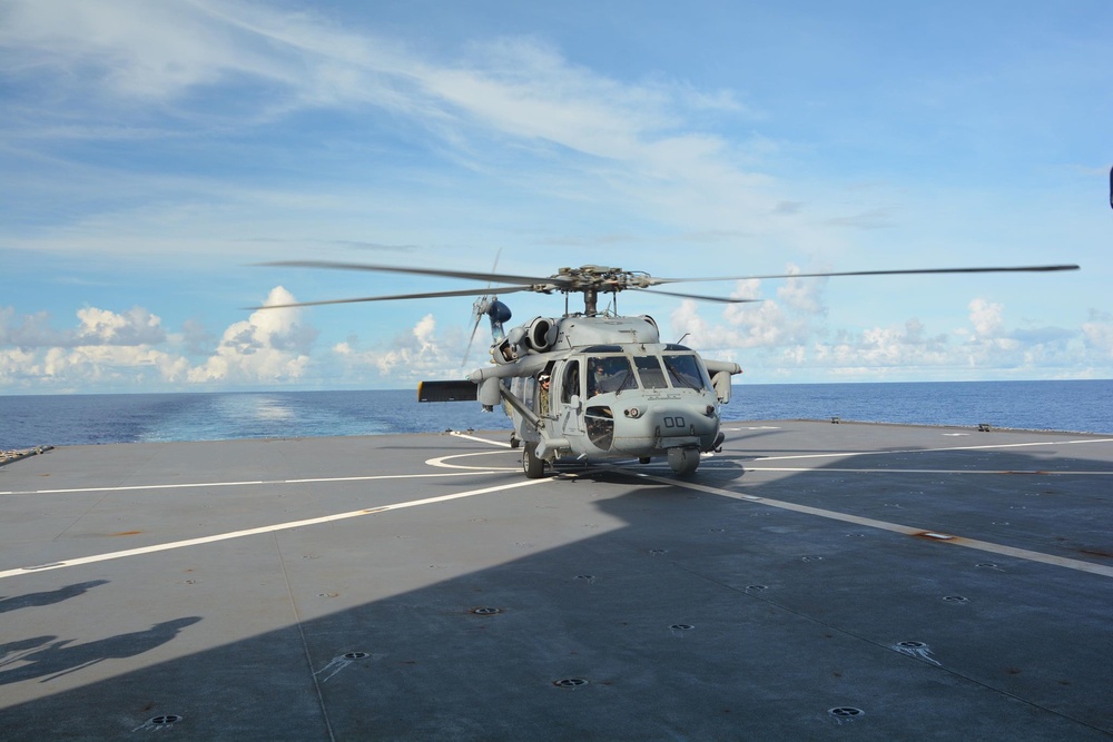 Helicopter Sea Combat Squadron (HSC) 25 lands on HMNZS Aotearoa to support a medical evacuation.