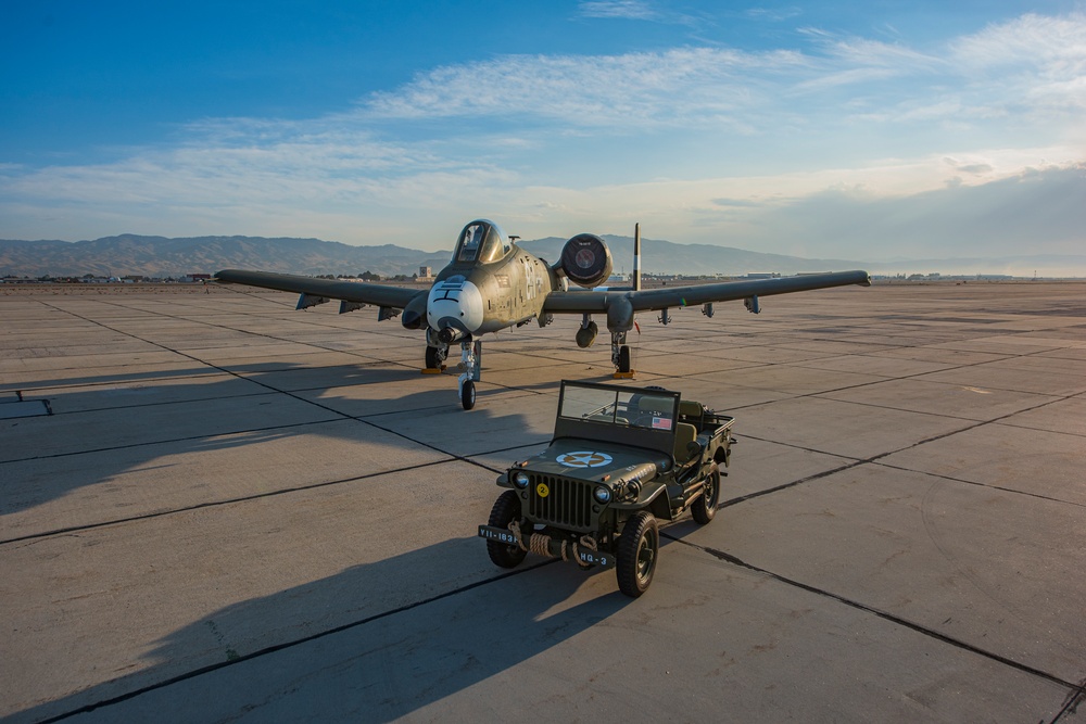 Idaho's A-10 Warthog painted to honor the WWII P-47 hangs out with a WWII Willys Jeep