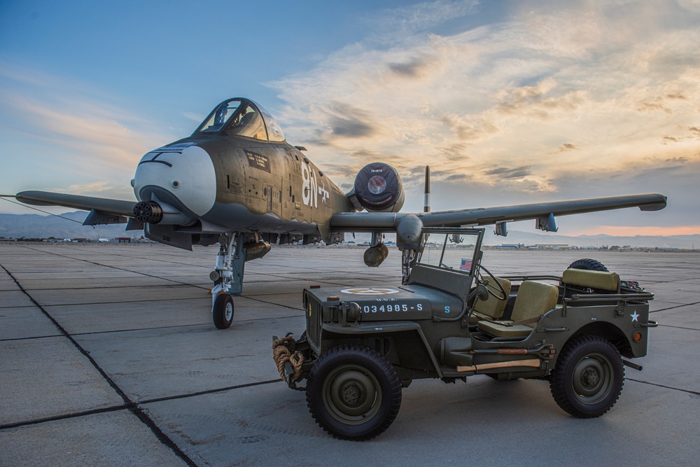 Idaho's A-10 Warthog painted to honor the WWII P-47 hangs out with a WWII Willys Jeep