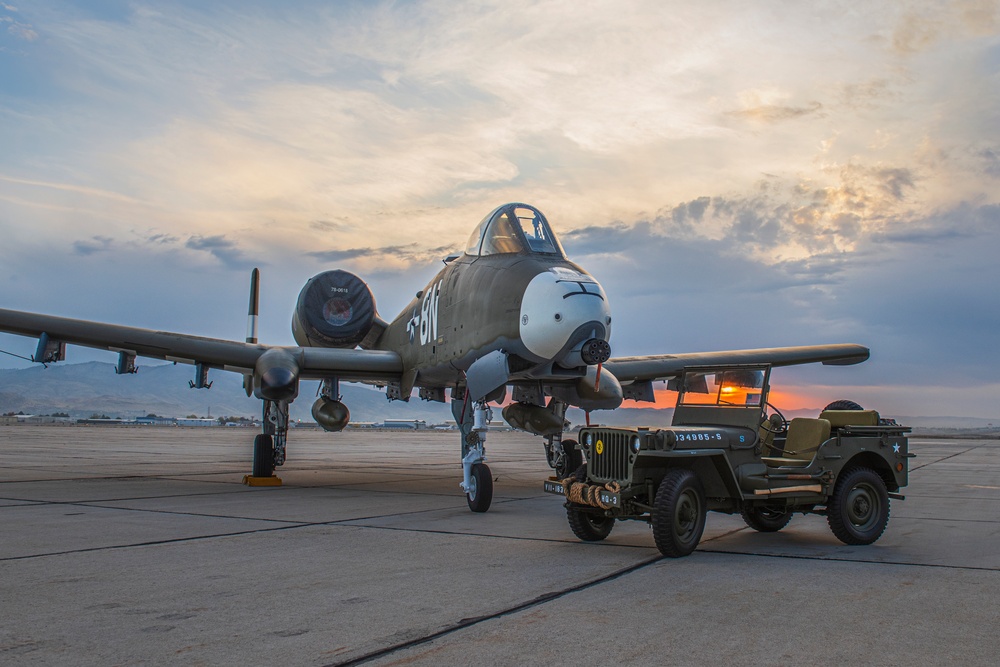 Idaho's A-10 Warthog painted to honor the WWII P-47 hangs out with a WWII Willys Jeep