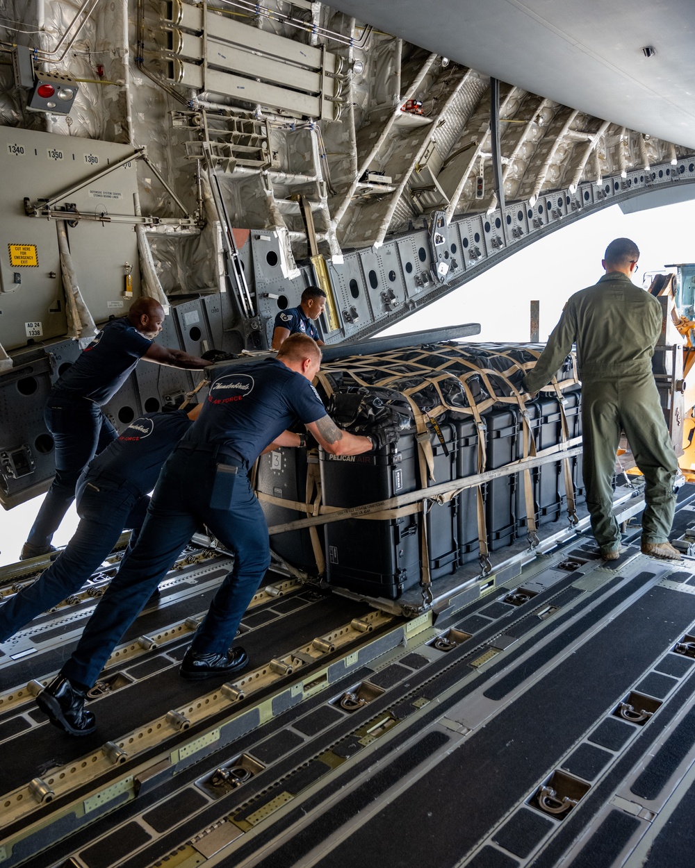 Thunderbirds unload cargo after arriving in Binghamton