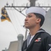 USS Mustin Sailor Mans the Rails During a Pass-in-Review in Celebration of Peru’s Bicentennial