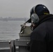 USS Mustin Sailor Shoots a Bearing as the Ship Steams in Formation During a “Parade of Ships”