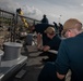 USS Sioux City Sailors Heave a Line During Sea and Anchor Detail
