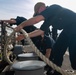 USS Sioux City Sailor Handles Line While Mooring in Ponce