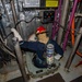 USS Billings Sailor Investigates a Simulated Flooding Casualty
