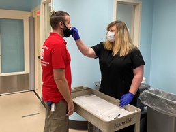 Occupational nurse administers COVID-19 rapid test