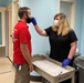 Occupational nurse administers COVID-19 rapid test