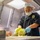 USS Charleston Sailor Prepares Meal
