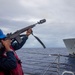 GMSN Raquell Carson Fires a Shot Line from the USS Dewey to the USNS Matthew Perry